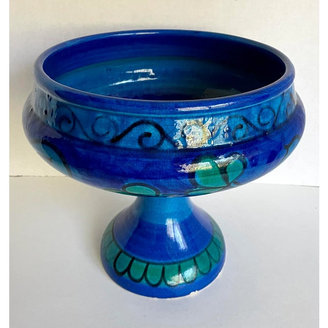 Here is a stunning bowl in vibrant blues and greens made in Italy in the mid-century, marked on the bottom. The shape is...