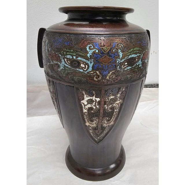 A late 20th Centuy Japanese Champleve Enamel Decorated Bronze Vase. Measures 6" in width, 6" in depth and 10" in height.