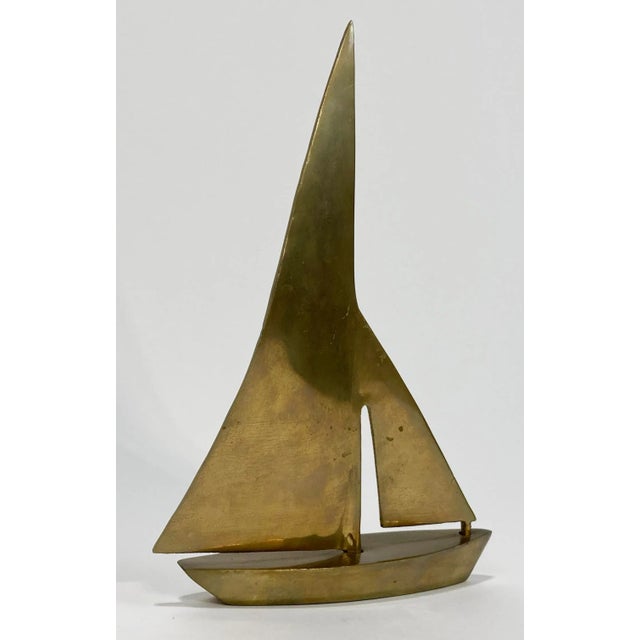 Vintage Mid-Century Modern MCM brass sailboat with modern lines and full sails. Design attributed to Dolbi Cashier....