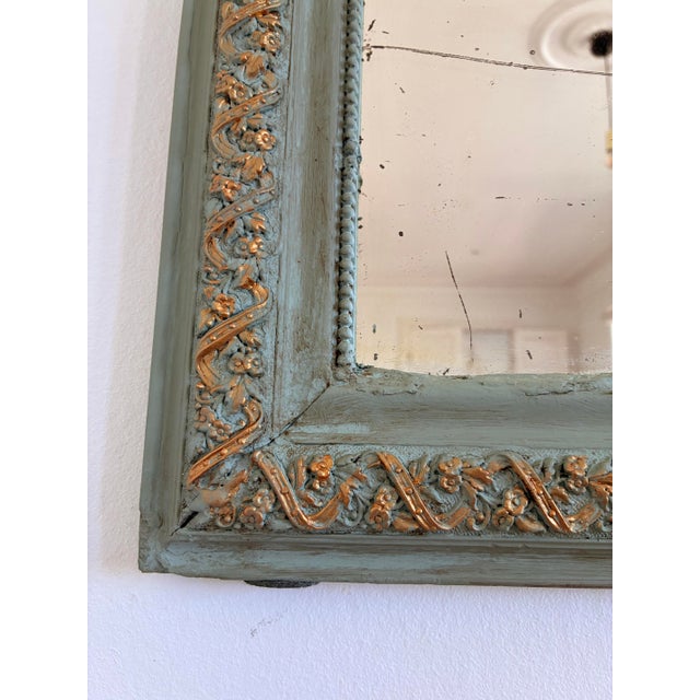 An elegant antique French Louis Philippe mirror dating from the late 19th century. This mirror features original mercury...