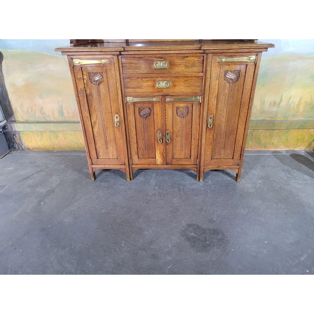 Superb two-part buffet in solid oak, in the Art Nouveau style, dating from the early 20th century. This elegant piece is...