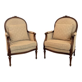 Pair of Mid-Century Louis XVI Style Carved Walnut Bergère Armchairs For Sale