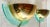 A set of wall lamps from the Postmodern period, 1980s. The lamps are made of gold-coloured brass and clear green...