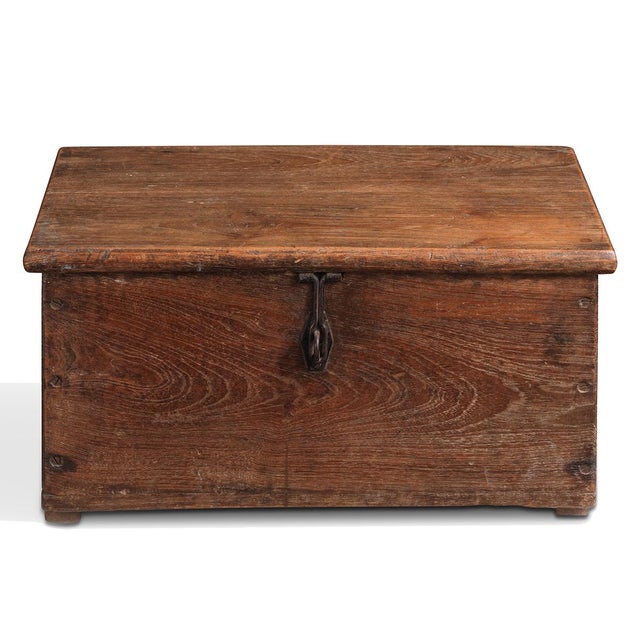 A beautifully aged vintage Indian wooden box that combines timeless craftsmanship with practical storage. Crafted from...