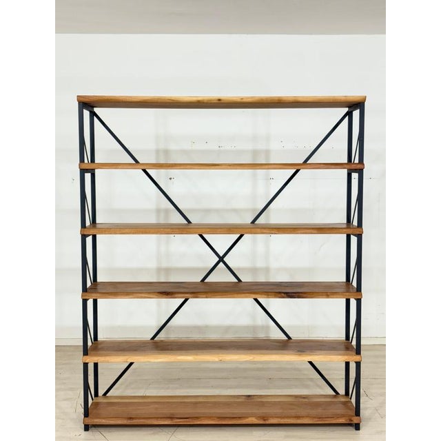 Exceptional shelving unit crafted from solid walnut, distinguished by its sculptural design. The asymmetrical arrangement...