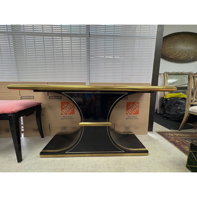 Mastercraft Console Table Designed By William Doezema. Offered is a shapely black lacquer and brass console table desgined...