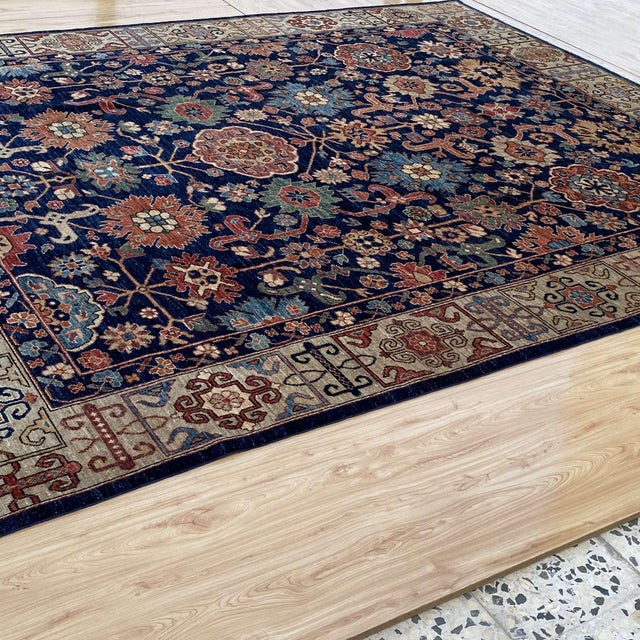 Persian Mahal design hand-knotted rug featuring a rich indigo navy field adorned with an all-over composition of bold...