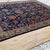 Persian Mahal design hand-knotted rug featuring a rich indigo navy field adorned with an all-over composition of bold...