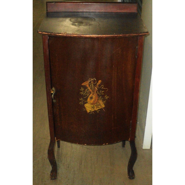 Antique Victorian Music Cabinet. Measures "38.25 H X "20 W X "15.25 D. Overall average condition. Has some veneer issues...