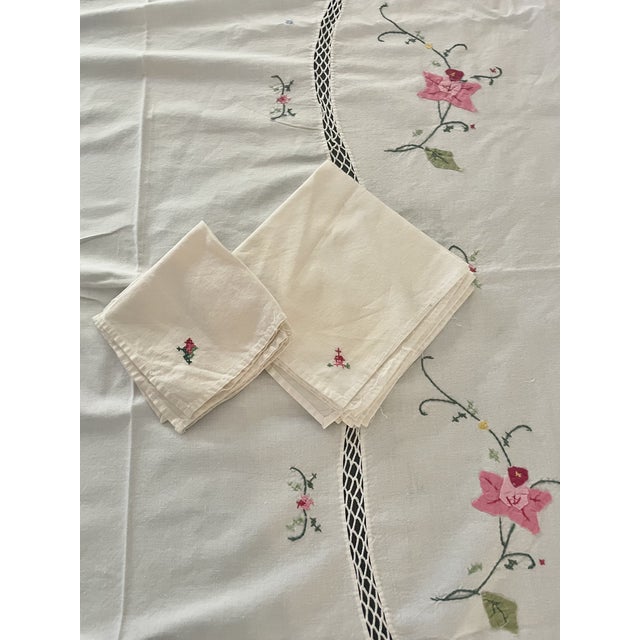 A beautifully handcrafted vintage linen set featuring delicate pink floral appliqué, intricate embroidery, and elegant...
