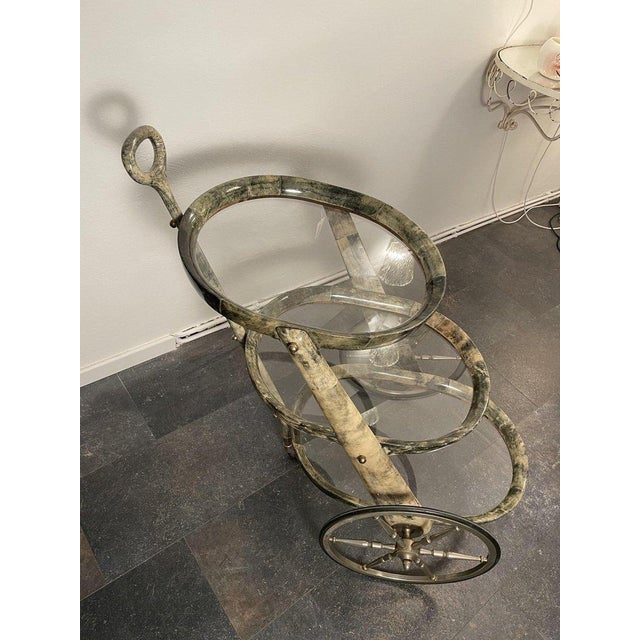 A rare design object by Aldo Tura, designed and manufactured around 1960/70. A very charming bar cart with a practical and...