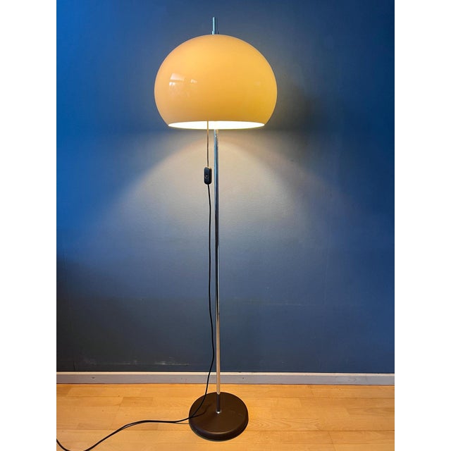 Beautiful mid-century mushroom floor lamp featuring a classic white acrylic glass shade. The shade can be easily moved up...