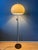 Beautiful mid-century mushroom floor lamp featuring a classic white acrylic glass shade. The shade can be easily moved up...