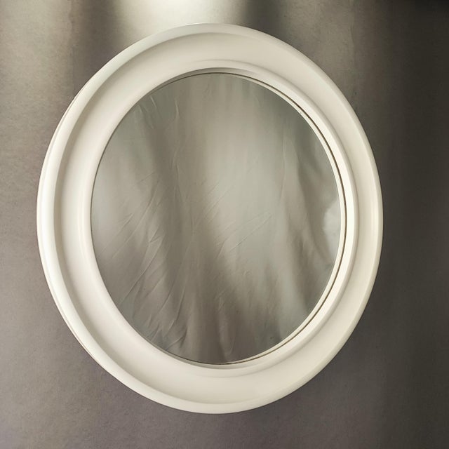 Round mirror in white plastic made in the 70s in Italy. By Carrara & Matta America Patented. Excellent vintage condition....