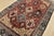An authentic vintage tribal Heriz rug hand-knotted with fine wool on a cotton foundation. This rug features geometric...