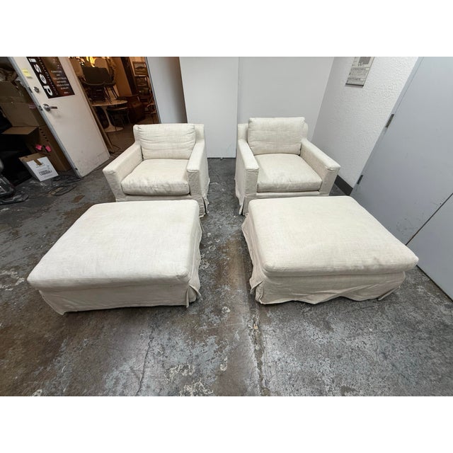 Design Plus Gallery presents a Pair of Belgian Linen Shelter Armchairs + Ottomas from Restoration Hardware. This European-...