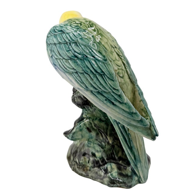 A wonderfully expressive mid-century Carolina Parakeet bird sculpture by Stangl Pottery of Flemington, New Jersey....