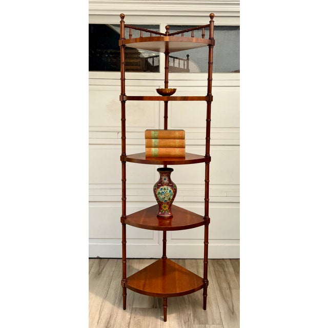 Here is a wonderful later mid-century wood corner étagère, dating to approximately the 1960s–70s. Crafted in a warm...
