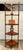 Here is a wonderful later mid-century wood corner étagère, dating to approximately the 1960s–70s. Crafted in a warm...