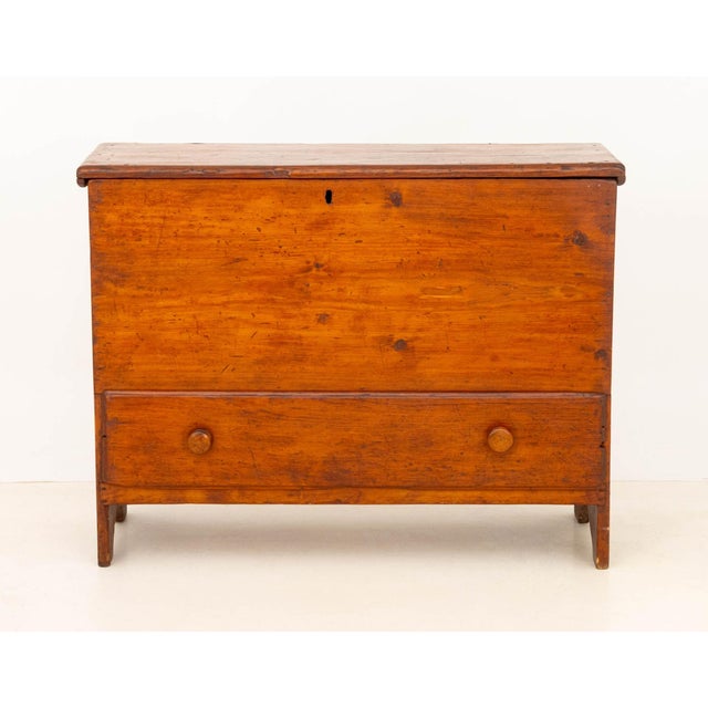 American Pine Mule Chest, circa 1800, the lift-top above a single drawer. 34" H x 44.5" W x 17.75" D. Provenance: From a...