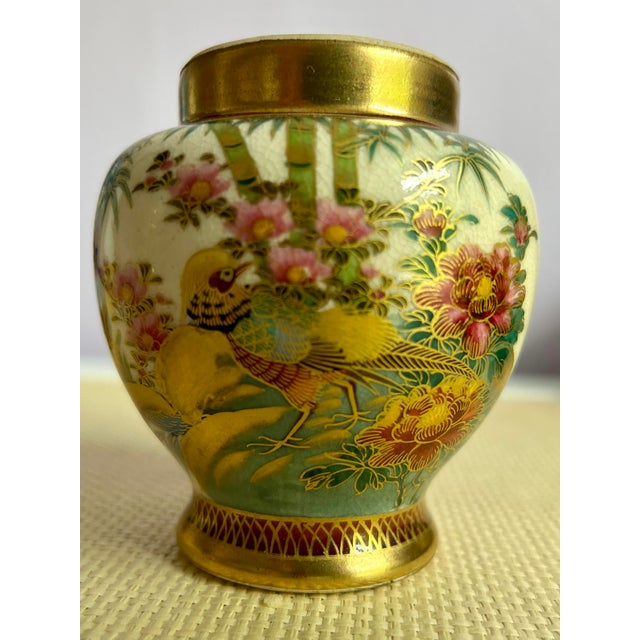 Finely hand crafted and hand painted Satsuma vase from Japan. Two makers mark appear on the underside, including what...