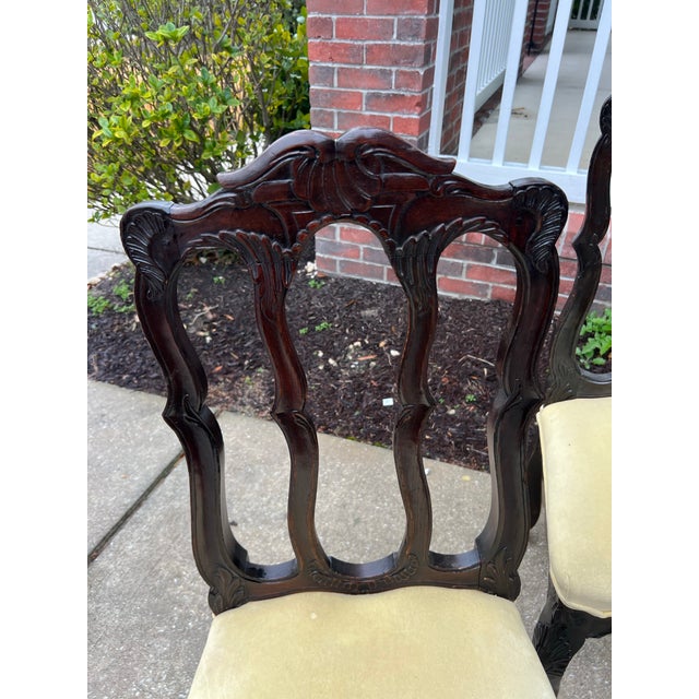 A beautiful set of 4 antique 1920’s side chairs with cushionsed seat upholstery .The Chairs made of Oak have lovely curves...