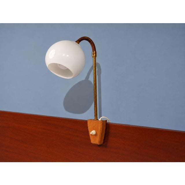 Swedish Mid-Century Modern, Clip-On Task Light or Sconce, Brass, Wood,Glass, Sweden, 1950s A unique bedside wall lamp or...