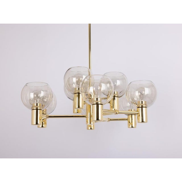 9-light brass chandelier in the style of sciolari. Smoked glass in a very beautiful color. Made with brass, best of the...