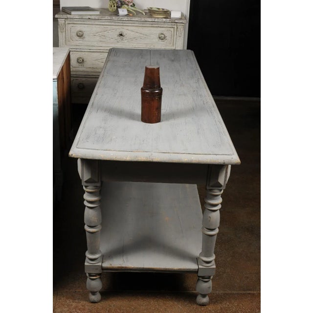 A large French treenware bottle from the late 19th century, with conic lid serving as a cup and tapering body. Born in...