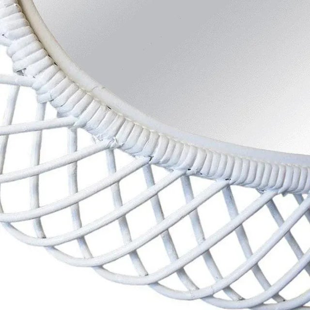 A flower burst or sunburst oval mirror handcrafted with rattan cane and wicker. A natural and fresh accent for any space...