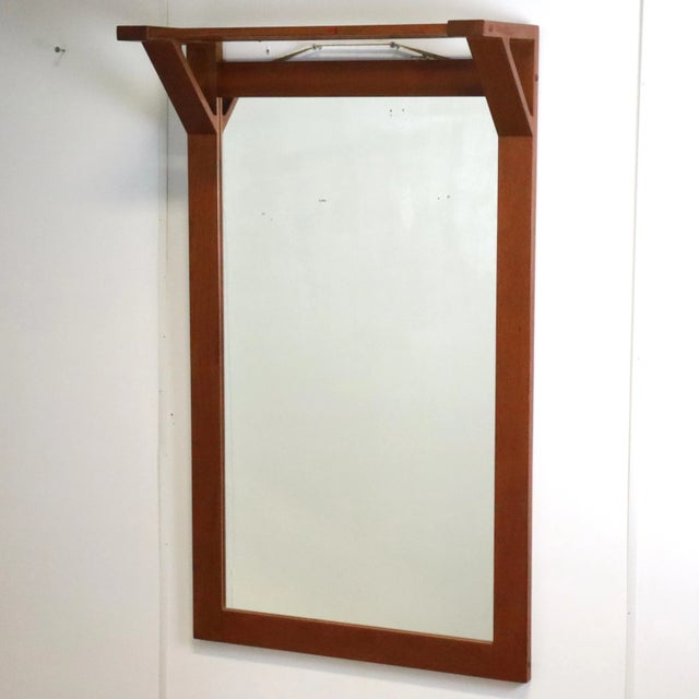 Very nice, large format mirror with a list / frame of solid wood and above it a beautifully executed parcel shelf. This...