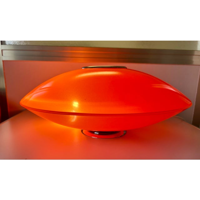 Orange lamp made of two glasses, with chrome finishes that take you back to the glorious 70s. European Plug (up to...