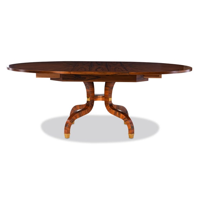 An exquisite dining table that celebrates artistry in wood craftsmanship. The Paldao wood top showcases a dramatic...