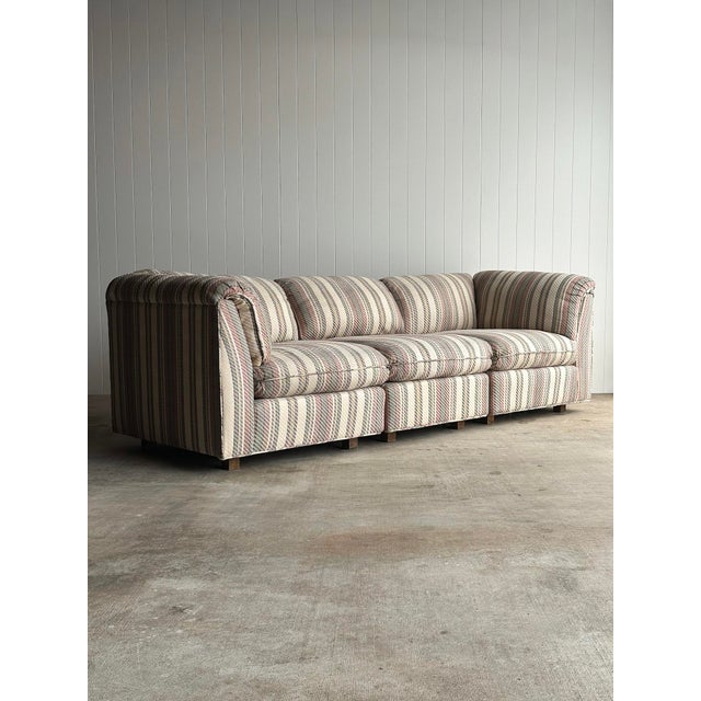 Vintage sectional sofa with a pillow-top back and arm rail. Three individual pieces allow flexible configurations...