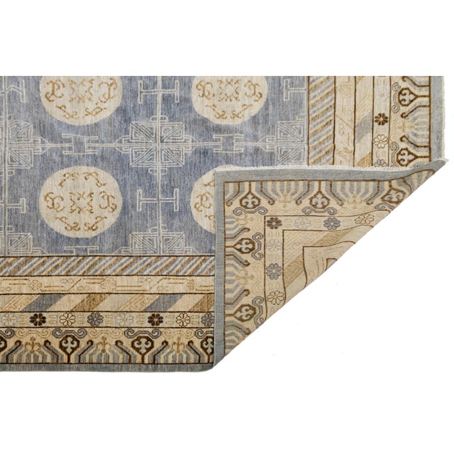 This modern Khotan wool rug beautifully blends Silk Road heritage with contemporary design. Hand-knotted from premium...