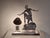 Art Deco table lamp, chrome with Bakelite clip-on shade, circa 1930, marked "LW Paris" on the underside. The back shows...