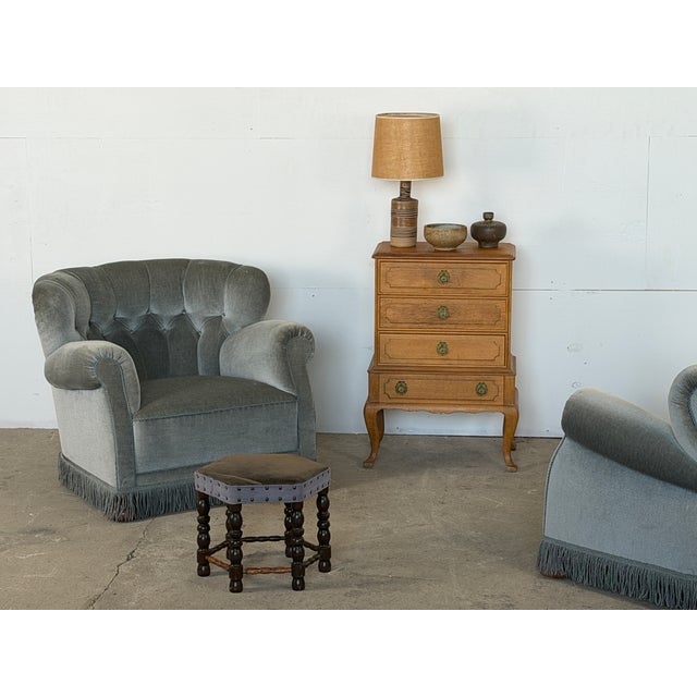 Pair of Danish lounge chairs in grey-blue velvet, in the manner of Fritz Hansen, circa 1940. Designer and maker are...