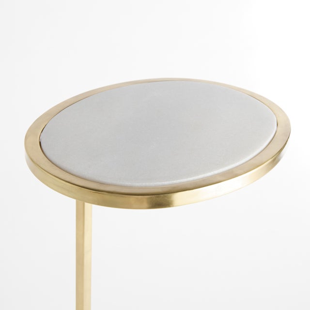 A simple mix ofWhite marble and brass creates a sophisticated look. A petite design, with a modern ring base and top, this...