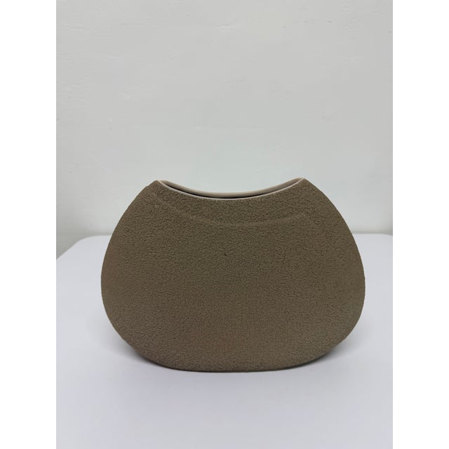 Modernist textured tan ceramic vase by Haeger, 2003.