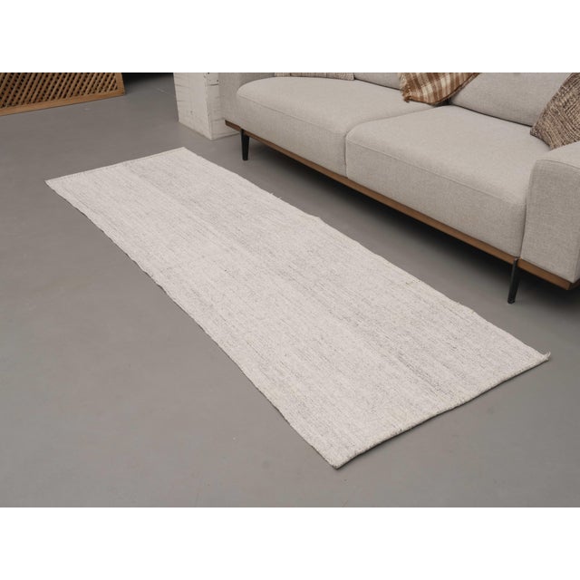 Vintage Hand-Knotted runner rug is a semi-antique vintage area rug. The '70s Eastern region of Anatolia's unique rug is...
