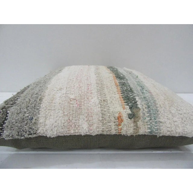 This is a pillow cover made from a vintage kilim rug. The piece was properly washed and ready to use. Pillow inserts not...