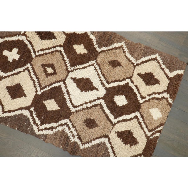 a small mid-20th-century Moroccan geometric runner in browns and creams Details rug no. j4443 size 2' 5" x 5' 8" (74 x 173 cm