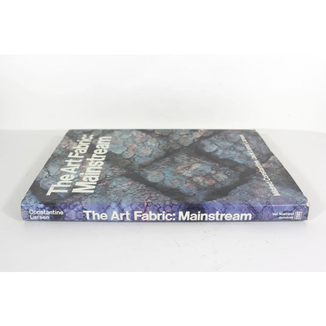 1981 The Art Fabric: Mainstream By Mildred Constantine/Jack Lenor Larsen 10.5” wide 14” tall 1” deep The dust jacket has...
