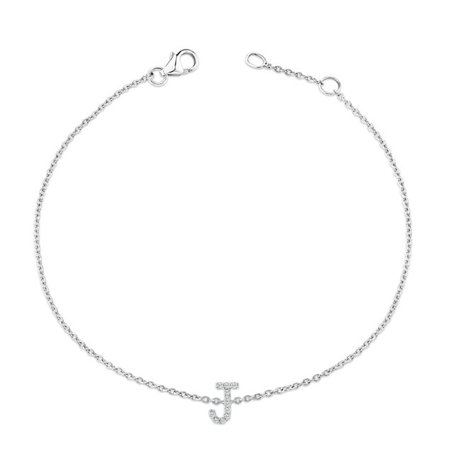 Immerse yourself in the understated elegance of this 10K white gold bracelet, rhodium-plated for an enrapturing shimmer...