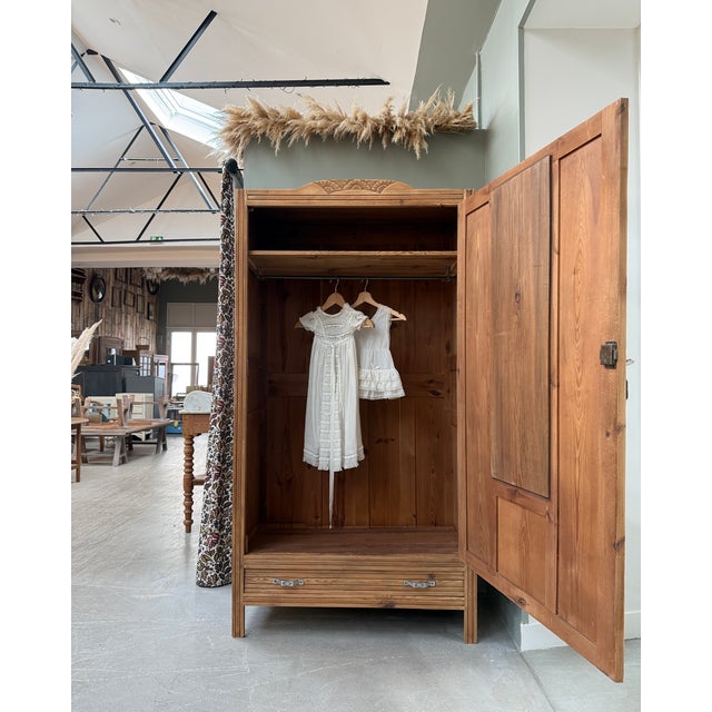 Graceful and well-proportioned, this art deco wardrobe combines a hanging space, storage, and a mirror in a single unit,...