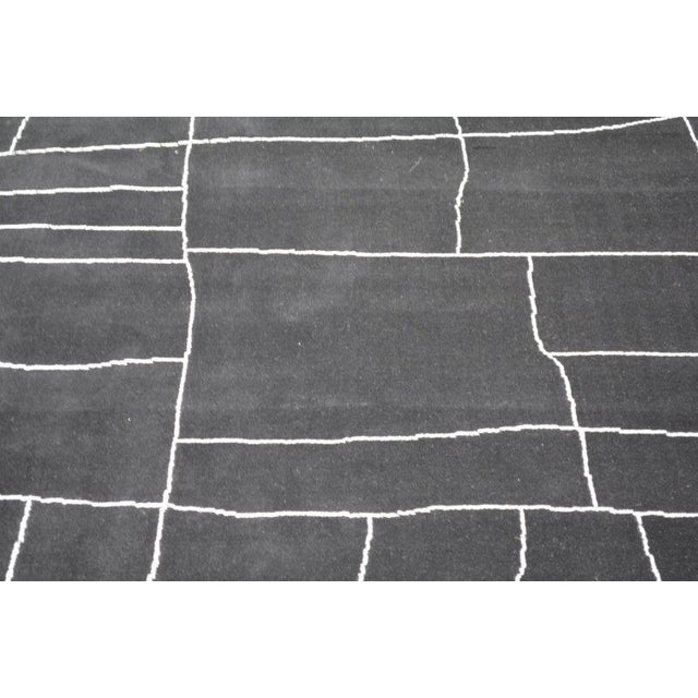 Moroccan Hand-knotted with care using traditional rug-making techniques, this wool rug blends timeless craftsmanship with...