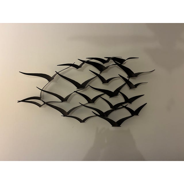 This metal birds in flight looks amazing on any wall.