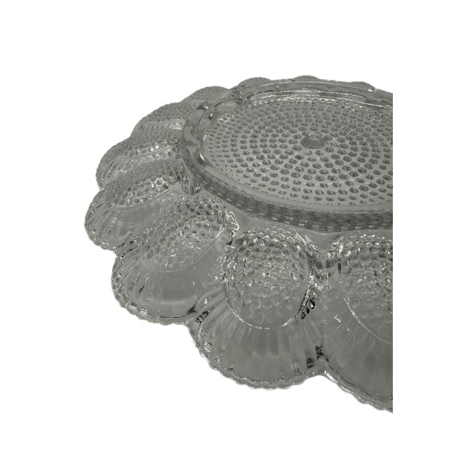 A lovely 1960s Indiana Glass deviled egg platter. Featuring a tactile hobnail surface with no faults, this platter is...