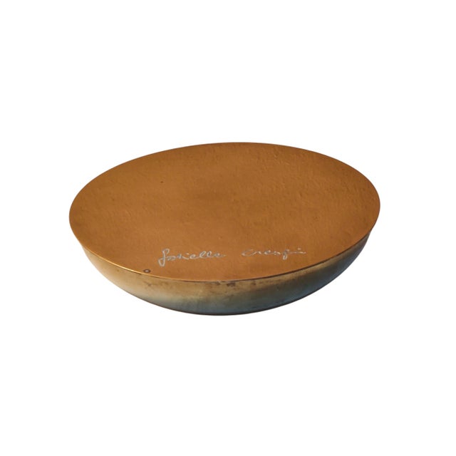 An elegant and refined tabletop ashtray/container by Gabriella Crespi, crafted from brass and featuring a simple,...