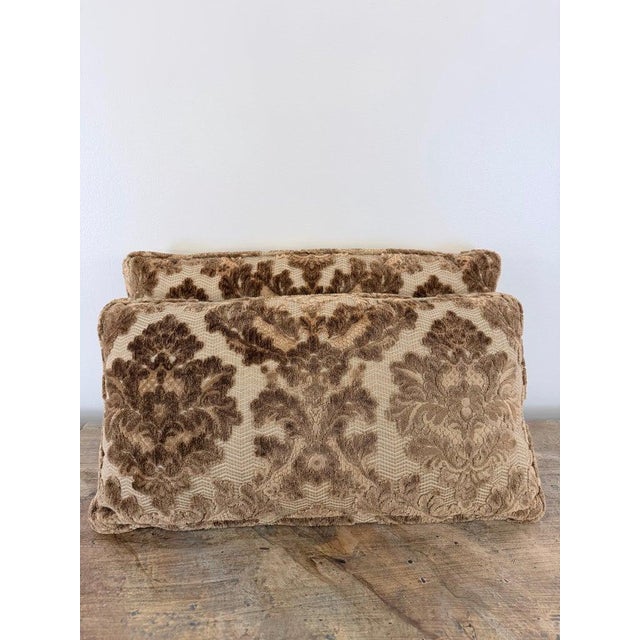 A sumptuous pair of lumbar pillows crafted in a rich cut-velvet damask. The design features a large-scale, scrolling...